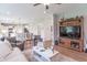 Bright living room showcasing a large entertainment center, plush furniture, and an open layout at 1417 Layton Rd, Anderson, IN 46011
