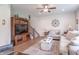 Cozy living room with plush seating, modern ceiling fan, and neutral decor at 1417 Layton Rd, Anderson, IN 46011