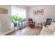 Comfortable living room with wood floors, large window, and a cozy reading area at 1417 Layton Rd, Anderson, IN 46011