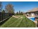 Spacious backyard featuring a rock garden, patio, and well-maintained lawn and fencing at 1426 Manchester Dr, Danville, IN 46122