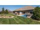 Tranquil backyard featuring a serene rock garden and a cozy patio with outdoor furniture at 1426 Manchester Dr, Danville, IN 46122