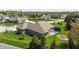 Aerial view of the backyard with a patio, a small pool, and well-maintained green lawn at 1426 Manchester Dr, Danville, IN 46122