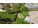 A beautifully landscaped backyard with a water feature, patio, and a well-maintained lawn at 1426 Manchester Dr, Danville, IN 46122