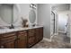 Stylish bathroom with double vanities, granite countertops, and decorative mirrors at 1426 Manchester Dr, Danville, IN 46122