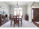 Elegant dining room featuring an arched window, chandelier and wood accents at 1426 Manchester Dr, Danville, IN 46122