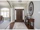 Welcoming foyer with hardwood floors, a decorative table, and a chandelier creating a stylish entrance at 1426 Manchester Dr, Danville, IN 46122