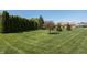 Expansive front yard with neatly mowed lawn and mature landscaping creating a welcoming exterior at 1426 Manchester Dr, Danville, IN 46122