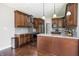 A modern kitchen features stainless steel appliances, granite counters, and sleek backsplash at 1426 Manchester Dr, Danville, IN 46122