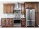 Contemporary kitchen boasts stainless steel appliances, sleek cabinets, and ample counter space at 1426 Manchester Dr, Danville, IN 46122