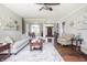 Inviting living room with neutral tones, hardwood floors, and an open layout to the dining area at 1426 Manchester Dr, Danville, IN 46122