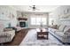 Spacious living room with stone fireplace, large windows, and elegant decor for a cozy atmosphere at 1426 Manchester Dr, Danville, IN 46122