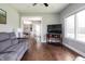 Open-concept living room with hardwood floors that flows into a dining area, creating an inviting space at 1426 Manchester Dr, Danville, IN 46122