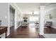 Bright living room featuring a stone fireplace, hardwood floors, and comfortable seating at 1426 Manchester Dr, Danville, IN 46122