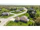 A wide aerial shot of a neighborhood with green lawns and tree-lined streets at 1426 Manchester Dr, Danville, IN 46122