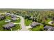 Aerial view of a residential neighborhood with tree-lined streets and well-maintained lawns at 1426 Manchester Dr, Danville, IN 46122