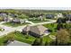 Aerial view of a residential street with well-maintained homes and green lawns at 1426 Manchester Dr, Danville, IN 46122