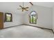 Large bedroom with neutral carpet, ceiling fan and two window views at 15 Northridge Ct, Brownsburg, IN 46112
