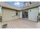 The new deck boasts brown deck boards with sliding glass door access to the home at 15 Northridge Ct, Brownsburg, IN 46112