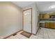 Inviting foyer with tiled flooring, white front door, and view into the kitchen at 15 Northridge Ct, Brownsburg, IN 46112