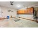 Spacious garage with ample storage cabinets, water heater, and convenient access door at 15 Northridge Ct, Brownsburg, IN 46112