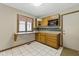 Eat-in kitchen features a breakfast bar, wooden cabinets, and neutral countertop at 15 Northridge Ct, Brownsburg, IN 46112