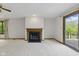 Bright living room with fireplace, access to the deck, and natural light at 15 Northridge Ct, Brownsburg, IN 46112