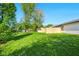 Picturesque backyard featuring well-maintained lawn and a wood fence at 155 Suncrest Dr, Greenwood, IN 46143