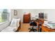 Comfortable bedroom with a twin bed, dresser, and desk, creating a functional and cozy space at 155 Suncrest Dr, Greenwood, IN 46143