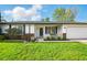 Attractive single-story home with a well-kept lawn and welcoming front entrance at 155 Suncrest Dr, Greenwood, IN 46143