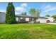 Well-maintained home with a spacious lawn, attached garage, and neatly landscaped front yard at 155 Suncrest Dr, Greenwood, IN 46143