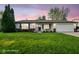Charming single-story home featuring a well-manicured lawn, attached garage, and inviting front porch at 155 Suncrest Dr, Greenwood, IN 46143