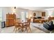 Cozy living room and dining area with wood floors and ample seating at 155 Suncrest Dr, Greenwood, IN 46143