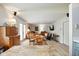Spacious room connecting dining area with vinyl floors, and access to the outdoor patio at 155 Suncrest Dr, Greenwood, IN 46143
