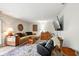Cozy living room featuring a sectional sofa, accent rug, and mounted TV, creating an inviting space at 155 Suncrest Dr, Greenwood, IN 46143