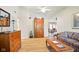 Spacious living room with a high ceiling, wood floors, and comfortable seating, showcasing an open layout at 155 Suncrest Dr, Greenwood, IN 46143
