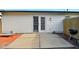 Enclosed brick patio with privacy fence, and access to the home through double glass doors at 155 Suncrest Dr, Greenwood, IN 46143