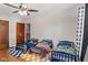 Spacious bedroom with ceiling fan, hardwood flooring, and three toddler beds at 17 W Washington St, Mooresville, IN 46158