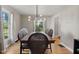 Elegant dining room with wooden floors, a modern chandelier, and a dining table set for a cozy meal at 17 W Washington St, Mooresville, IN 46158