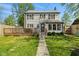 Charming home featuring a large rear deck, well-maintained lawn, and classic architecture perfect for entertaining and relaxation at 17 W Washington St, Mooresville, IN 46158