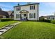 Charming two-story home featuring a well-manicured lawn and classic architectural details at 17 W Washington St, Mooresville, IN 46158