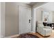 Inviting foyer with hardwood floors and a cozy seating area, creating a warm welcome at 17 W Washington St, Mooresville, IN 46158