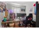 Gaming room with multi-monitor setup, gaming chair, and colorful LED accents at 17 W Washington St, Mooresville, IN 46158
