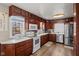 A lovely kitchen featuring wood cabinets, modern appliances, and light countertops offering ample workspace at 17 W Washington St, Mooresville, IN 46158