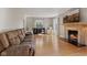 Spacious living room with a fireplace, hardwood floors, and comfortable seating, ideal for gatherings at 17 W Washington St, Mooresville, IN 46158