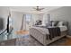 Serene main bedroom with plush bedding, soft lighting, and warm hardwood floors for ultimate relaxation at 17 W Washington St, Mooresville, IN 46158