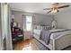 Spacious main bedroom featuring a comfortable king-size bed, soft lighting, and a large window for natural light at 17 W Washington St, Mooresville, IN 46158
