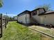 Great backyard featuring a spacious yard, tall wooden fence, and steps to a sunroom at 1705 Witt Rd, Lebanon, IN 46052