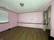 A bedroom showcasing wood-style floors and a window, ideal for rest and relaxation at 1705 Witt Rd, Lebanon, IN 46052