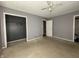 Bedroom with neutral walls, ceiling fan, two windows for natural light, and closet at 1705 Witt Rd, Lebanon, IN 46052