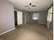 Bedroom with carpet, ceiling fan, and windows dressed with decorative chevron curtains at 1705 Witt Rd, Lebanon, IN 46052